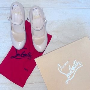 Red Bottom pumps with shoe bag and box